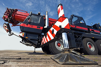 A huge powerful mobile crane and its support stud, ready for action